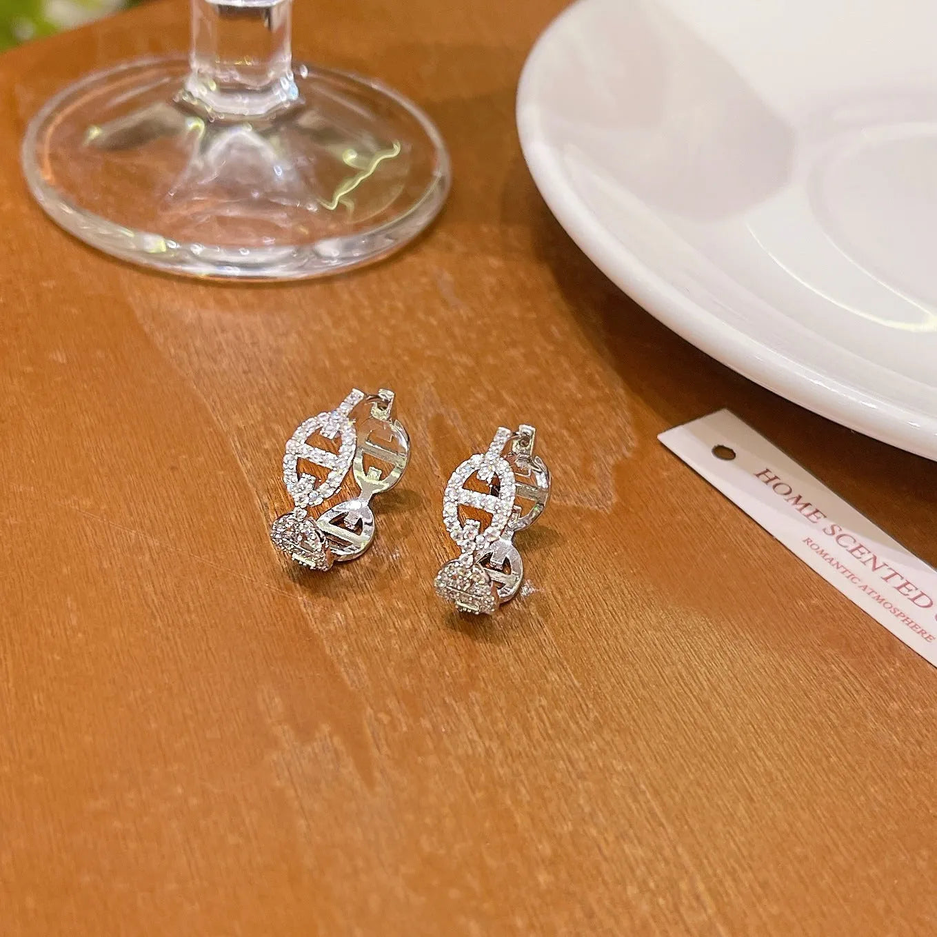 Women's diamond design electroplated earrings in silver, gold, and rose gold colour variations