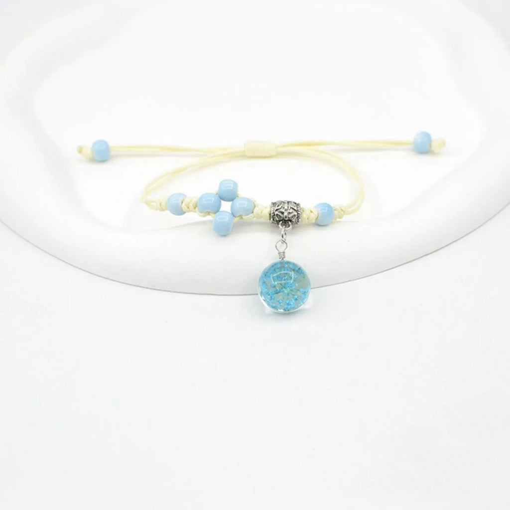 Glass dried flower bracelet with preserved flowers inside clear beads, available in multiple colours