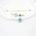 Glass dried flower bracelet with preserved flowers inside clear beads, available in multiple colours