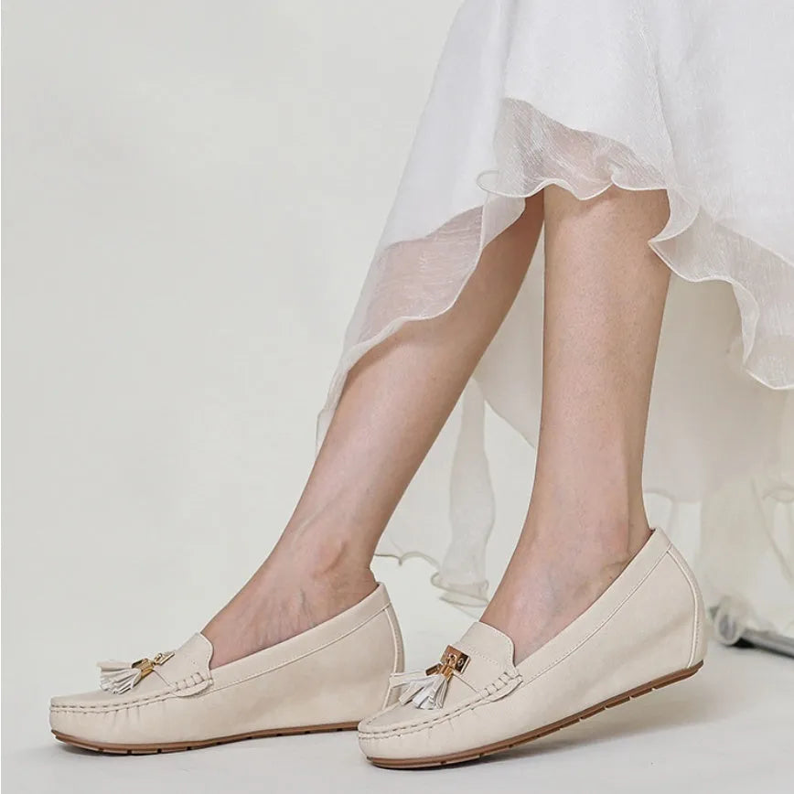 Nude casual work shoes with round toe and mid heel on a white background.