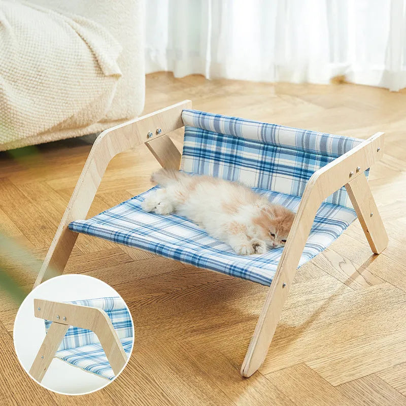 Wooden frame cat hammock bed with blue cloth fabric, elevated design for indoor cats.