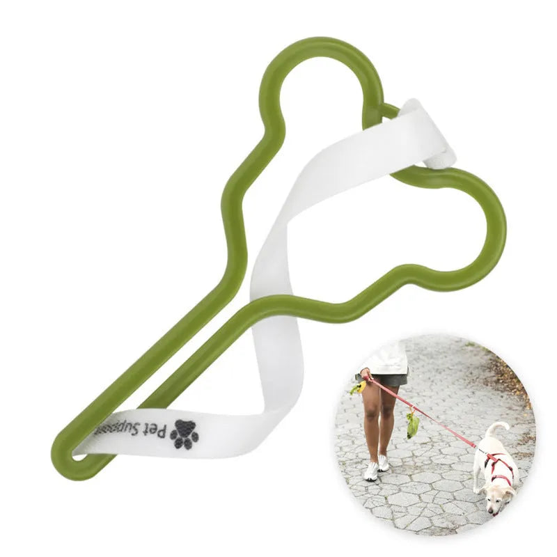 A hands-free dog waste bag holder with a Velcro strap, attached to a dog leash.