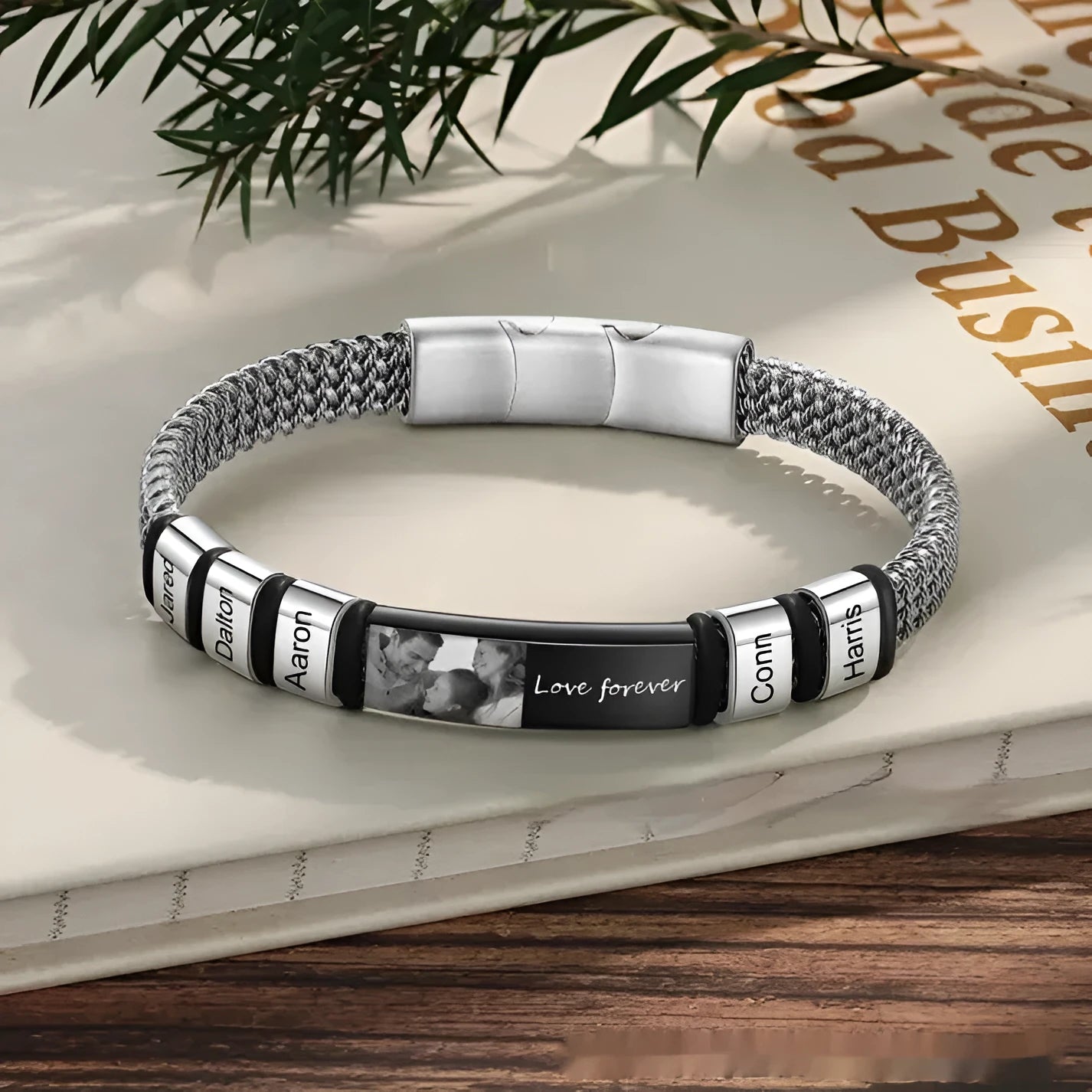 Titanium steel lettering bracelet with leather rope adjustable closure showing heart-shaped design detail