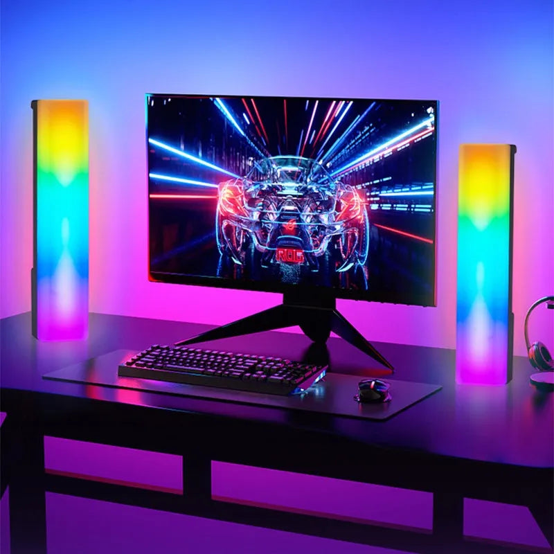 3D RGB voice-activated table top ambiance lamp in white or black shell with USB cable.