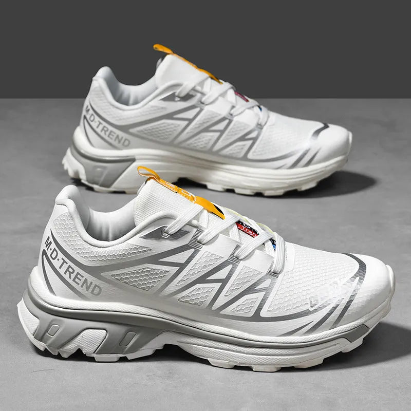 Men's and women's low-top artificial leather hiking shoes in multiple colours with flat rubber sole and lace-up front.