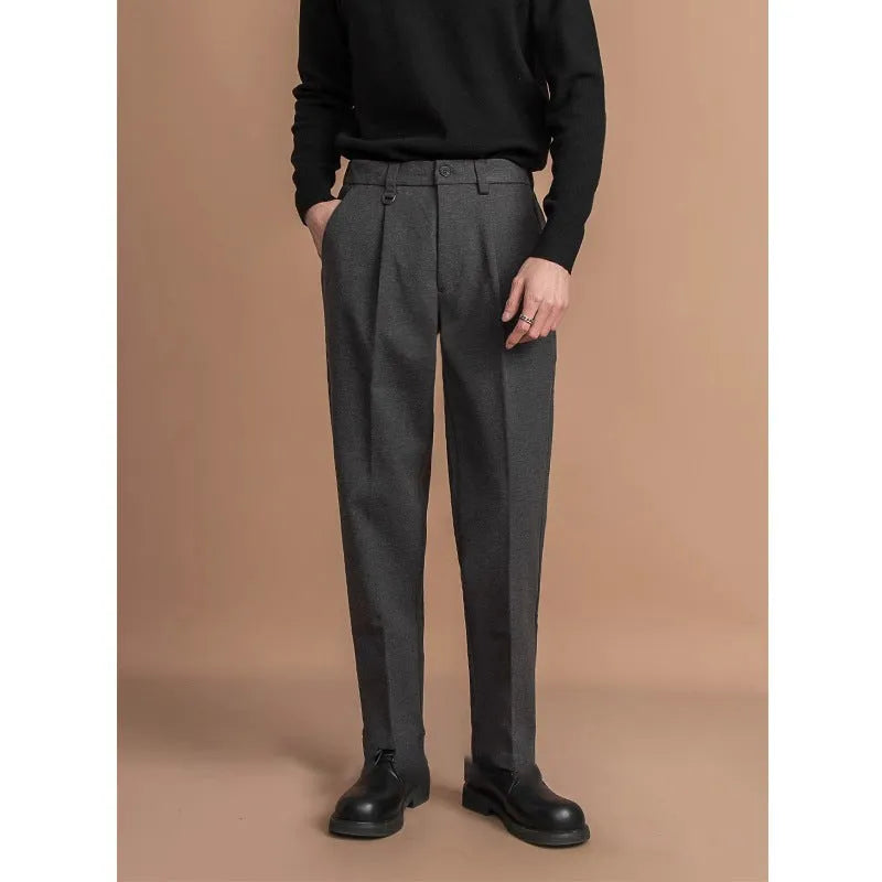 Men's straight-leg trousers in khaki colour on a hanger