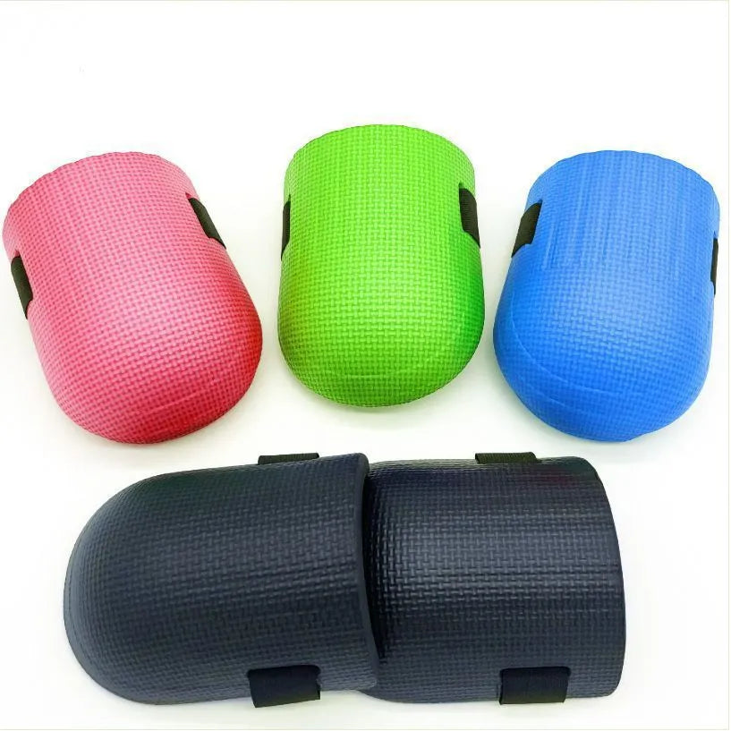 A pair of thick EVA foam kneepads in different colours for work on tile floors.