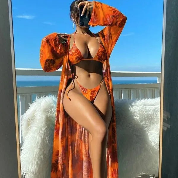 Women's long sleeve bikini set with banded briefs and matching outer robe in floral pattern