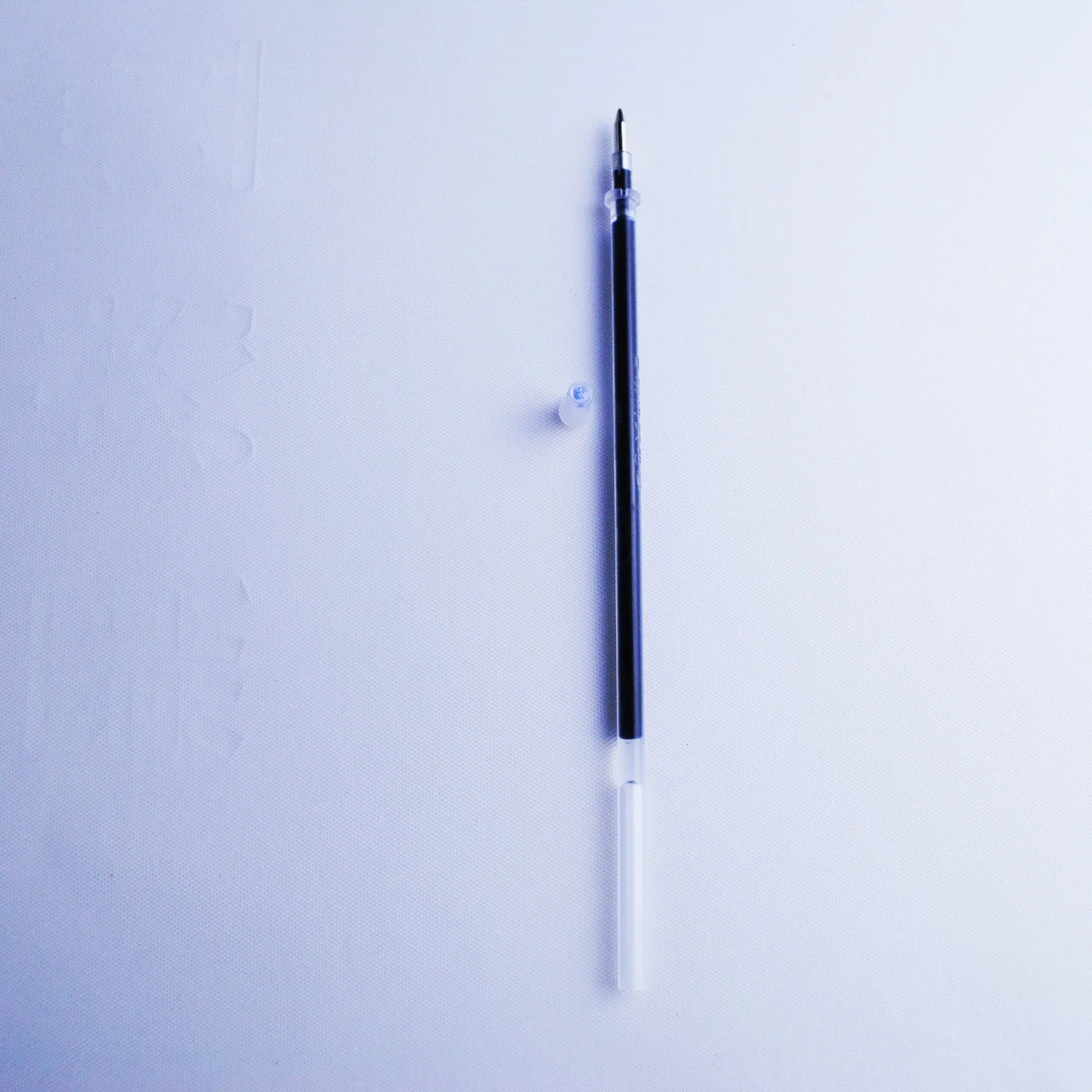 Automatic fading pen core set with 0.5mm tip and blue refills