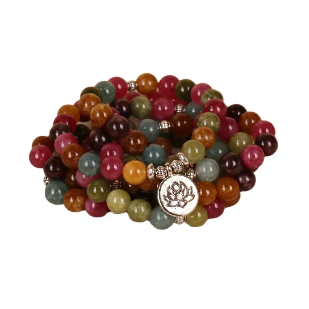 108-bead lotus hanging multi-layer bracelet in tourmaline colour on wrist