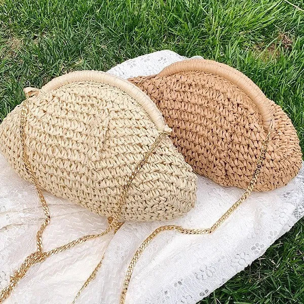 Khaki shell-shaped straw shoulder bag for women with chain detail and an internal zipper pocket.