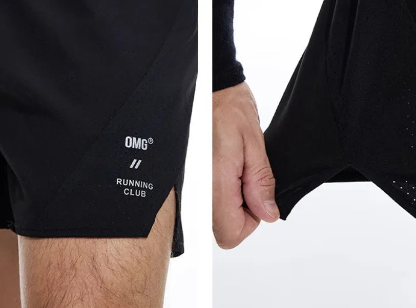 Black and blue four-point running shorts with laser stitching on stretch fabric.