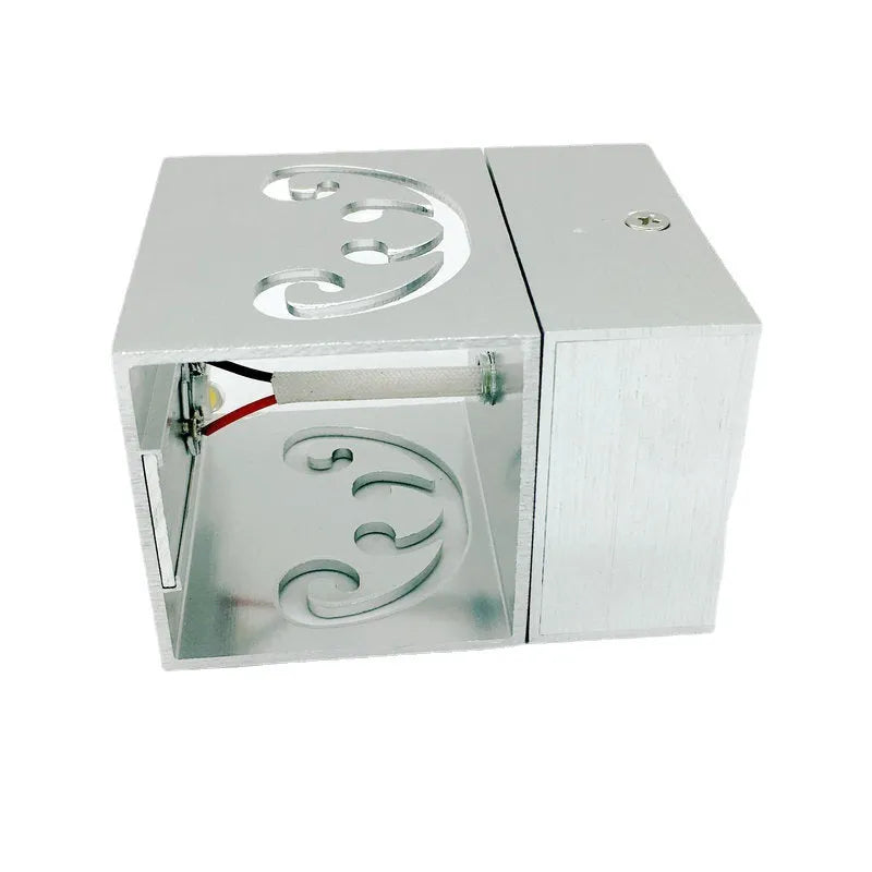 Modern butterfly-shaped aluminium LED wall lamp with colour-changing remote.