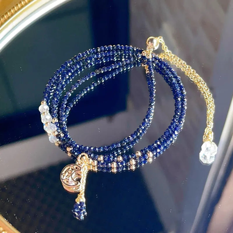 Blue sand stone cut three-ring bracelet with gold-tone metalwork, manual processing details visible