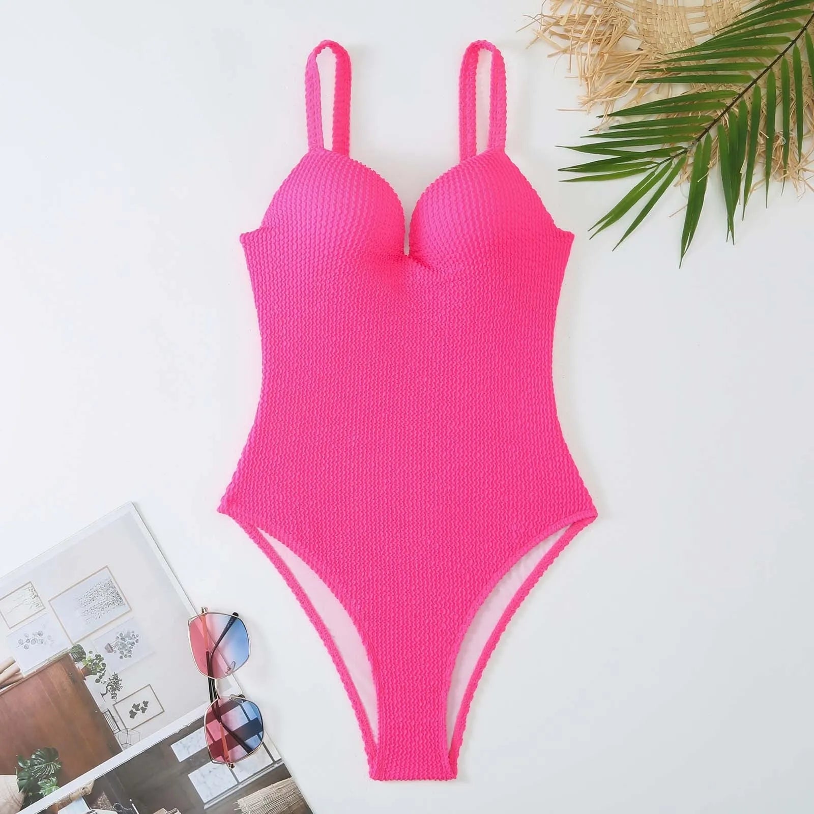Women's black one-piece swimsuit with a sunken white stripe pattern across the front, sleeveless design.