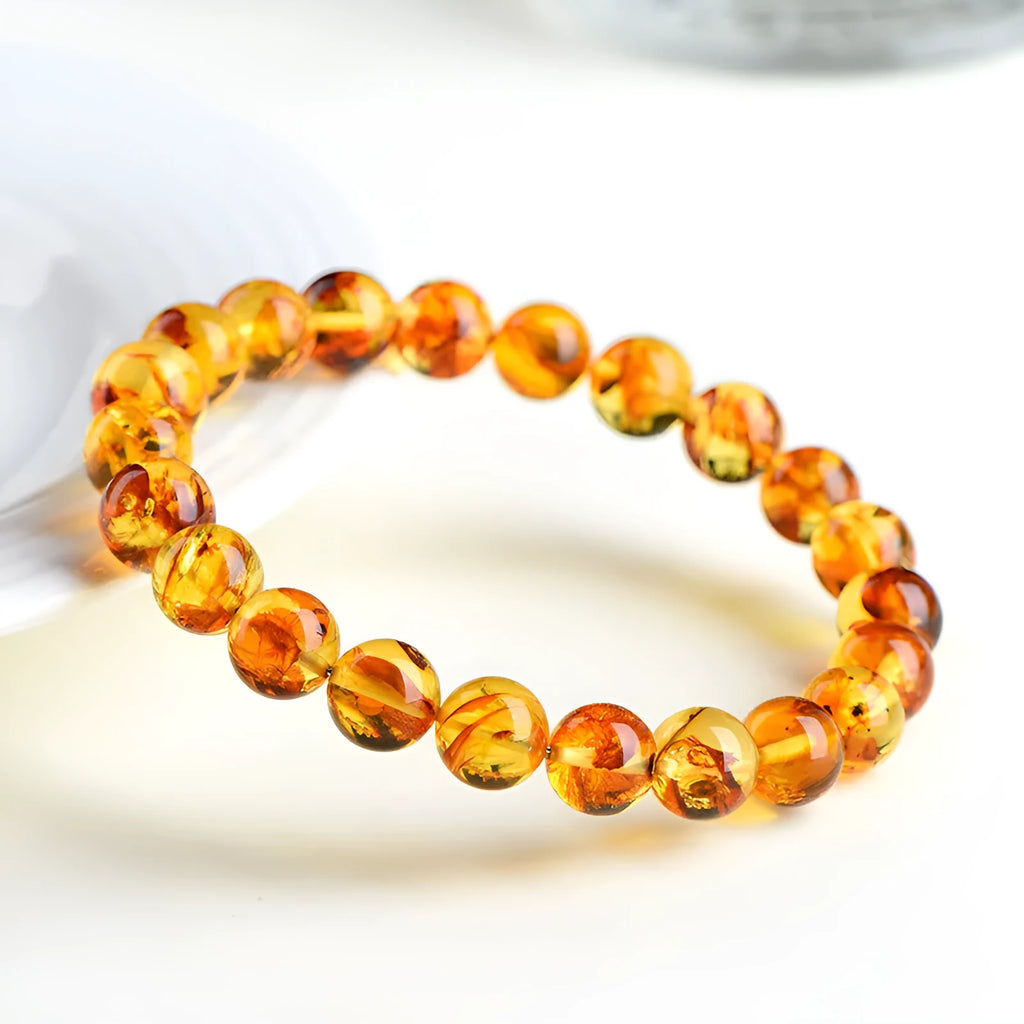 Natural yellow piebald amber bracelet with geometric beads in multiple diameter options