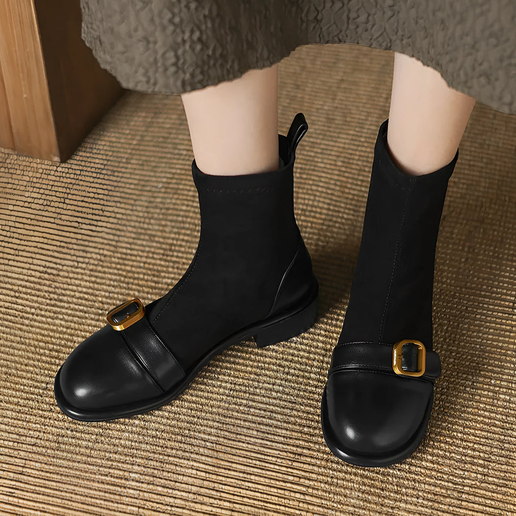 Women's black low heel Martin boots with buckle stitching and front lace-up fastening on a round toe.