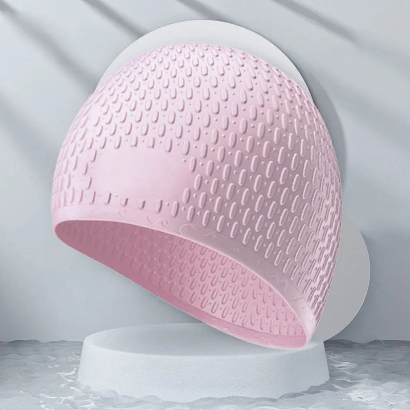 Silicone swimming cap for adults in various solid colours on a white background.