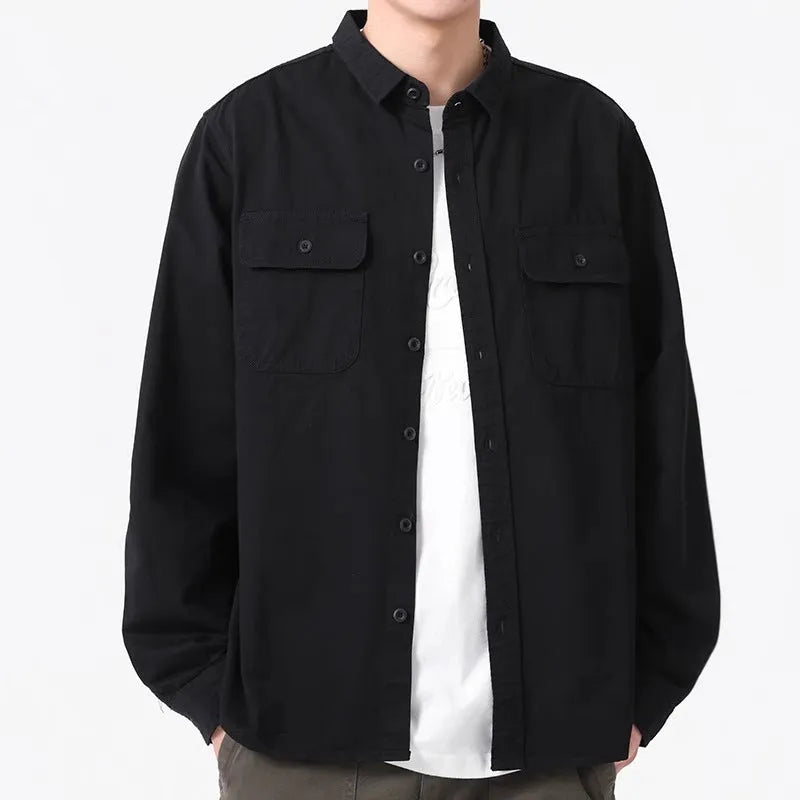 Man wearing a loose fit long sleeve overalls shirt in polyester, cardigan style.