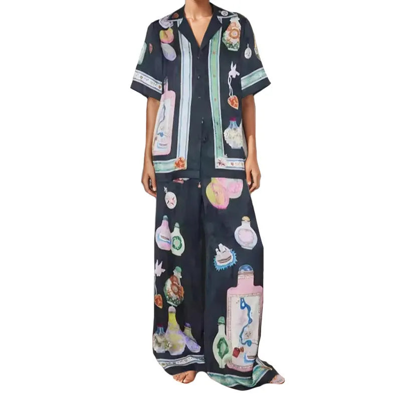 Black women's cardigan set with cartoon pattern, includes top with regular sleeves and matching trousers