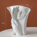 Ceramic decorative book stand in a modern simplicity style on a wooden desk.