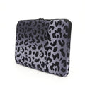 Leopard print laptop sleeve for 13-inch to 16-inch devices with waterproof polyester and anti-shock lining.