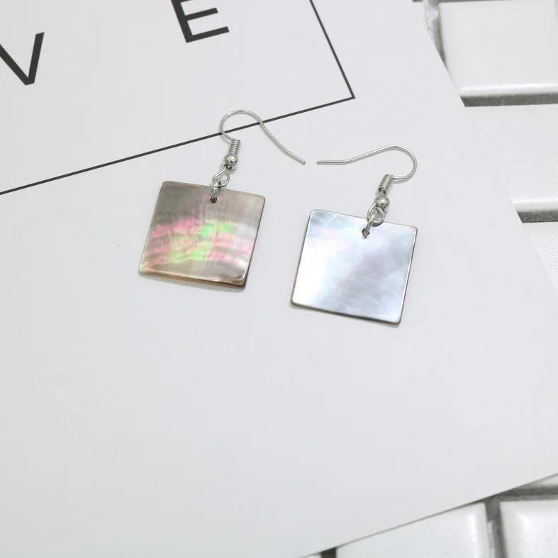 Women's geometric shell earrings in rectangular and square panther natural colours