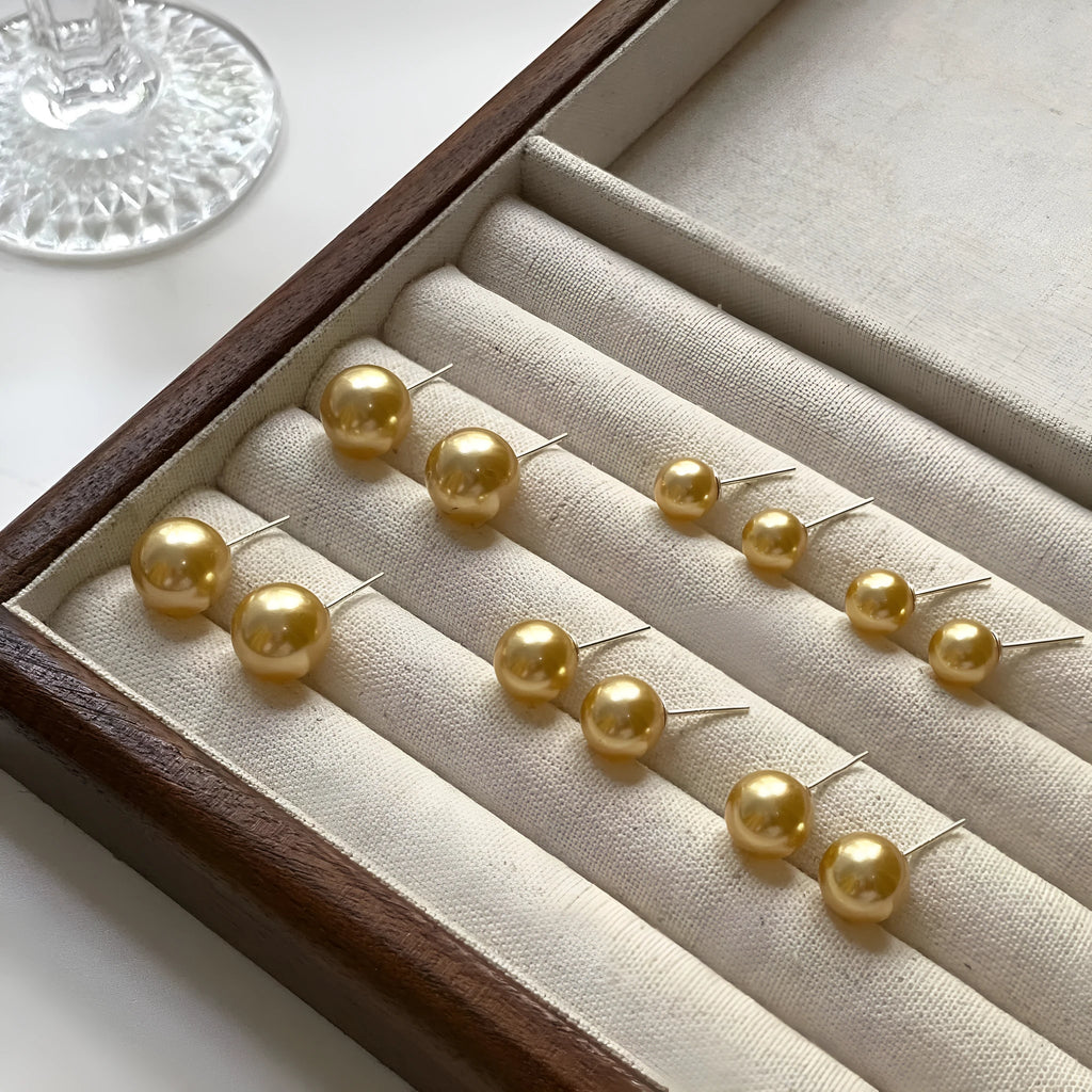 Geometric pearl stud earrings in silver with retro styling and multiple size options