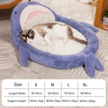 Blue shark pattern velvet pet bed for dogs or cats on a floor.