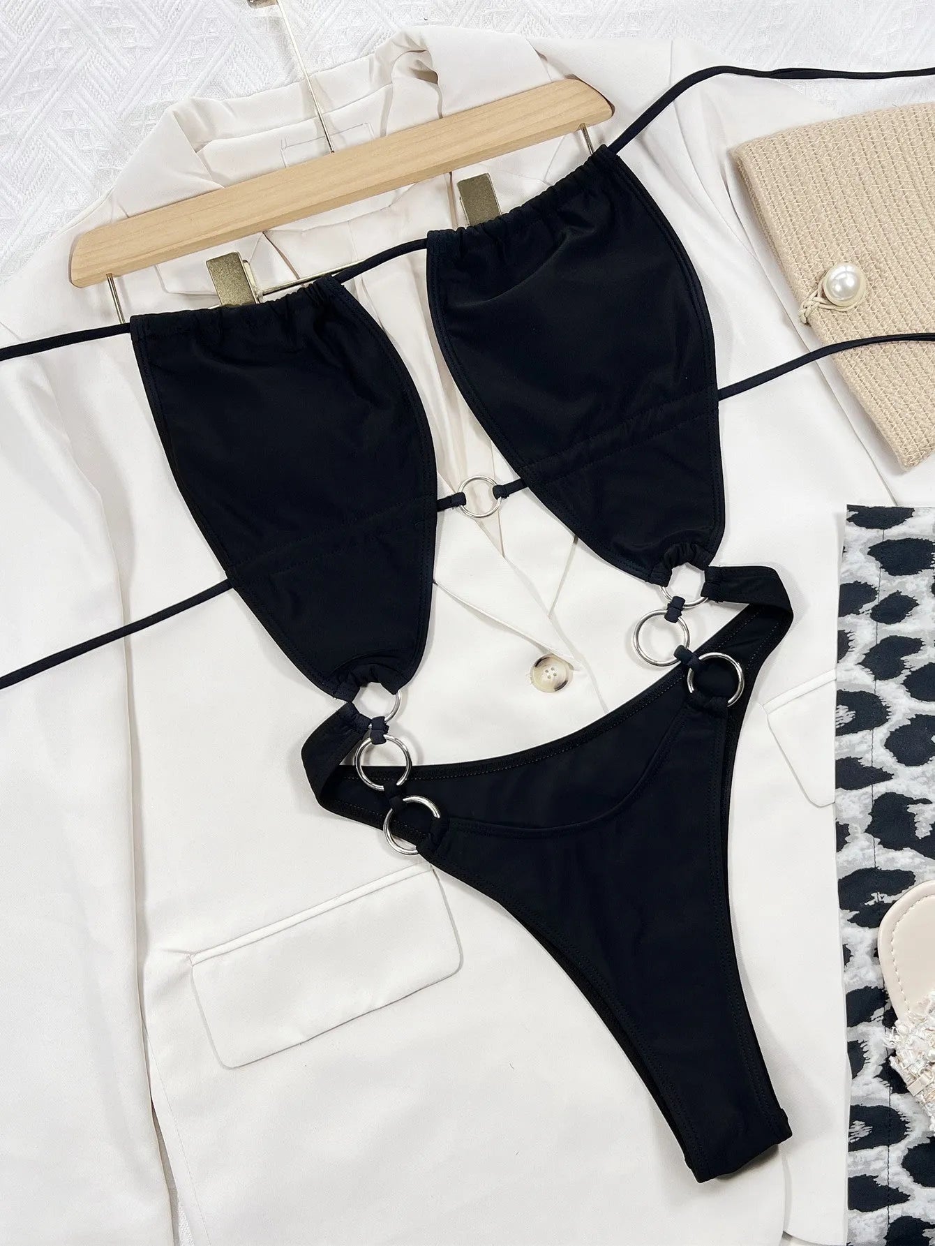 Steel Ring solid black sleeveless one-piece swimsuit for women on a white background.