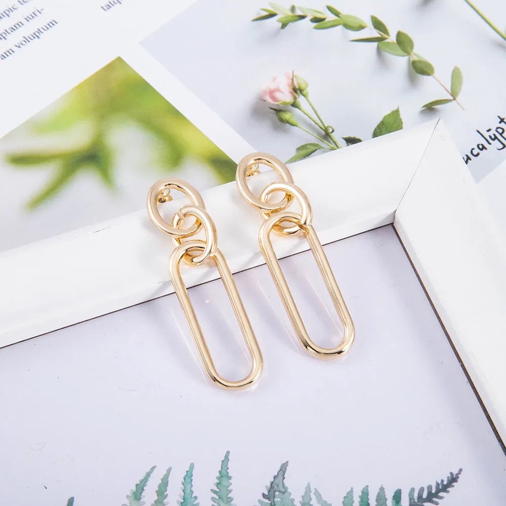 Sterling silver needle geometric hoop earrings with ring and line design on alloy base