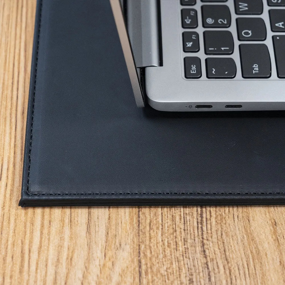 Durable heat-insulating anti-radiation tablet pad in four colour variations on a desk