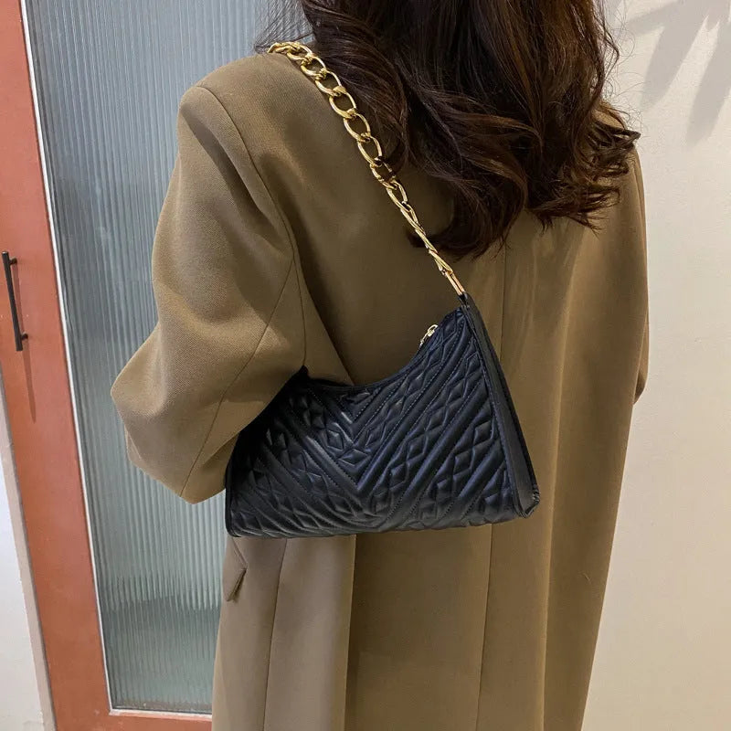 Black PU leather vertical square shoulder bag with chain strap, soft handle, and 3D outer pockets