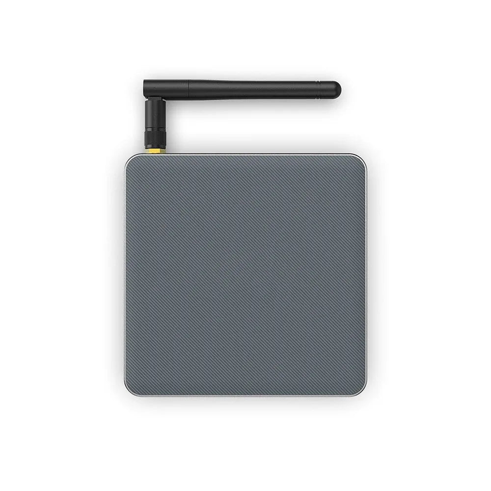 Compact black Android TV box with remote control and HDMI cable for 8K streaming