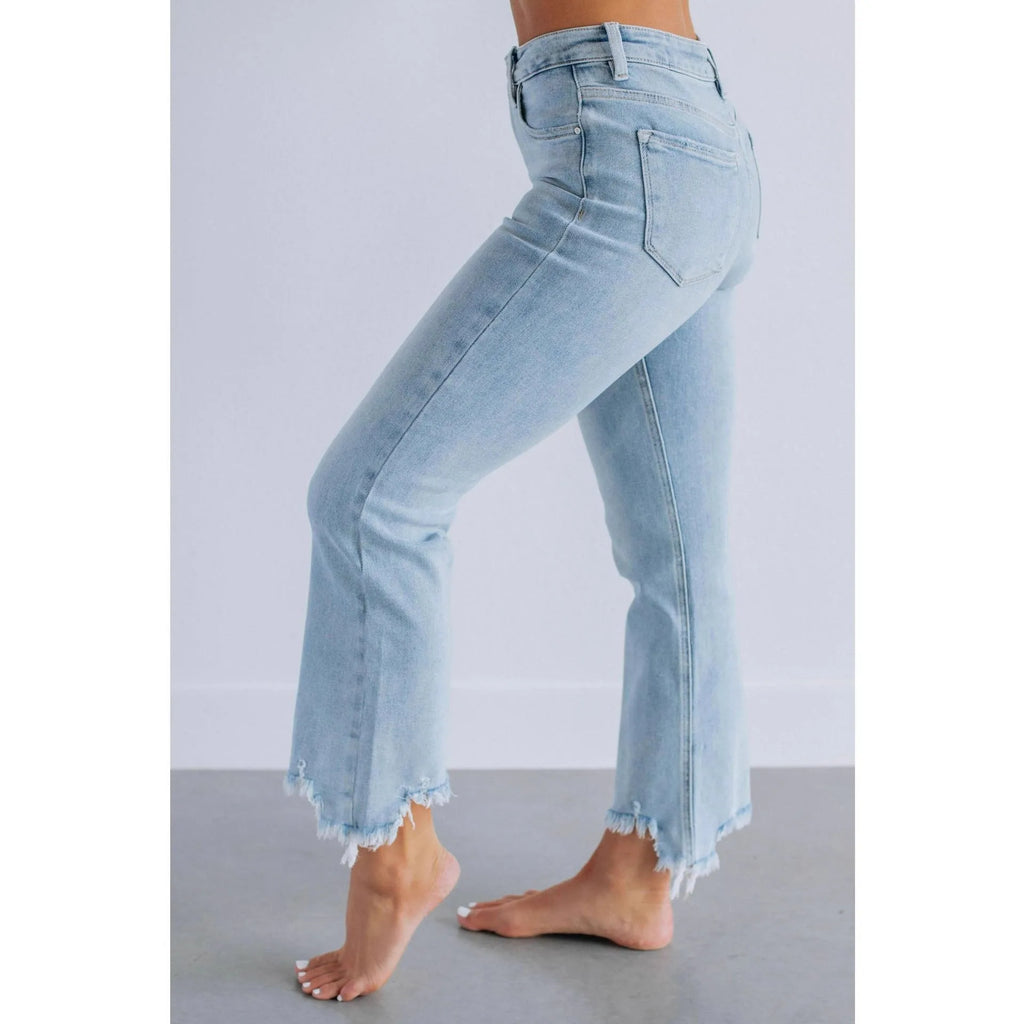 Women's dark blue cotton denim trousers with a hand-distressed casual finish.