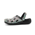 Black women's platform sandals with rhinestone decoration and multiple air holes on a white background.