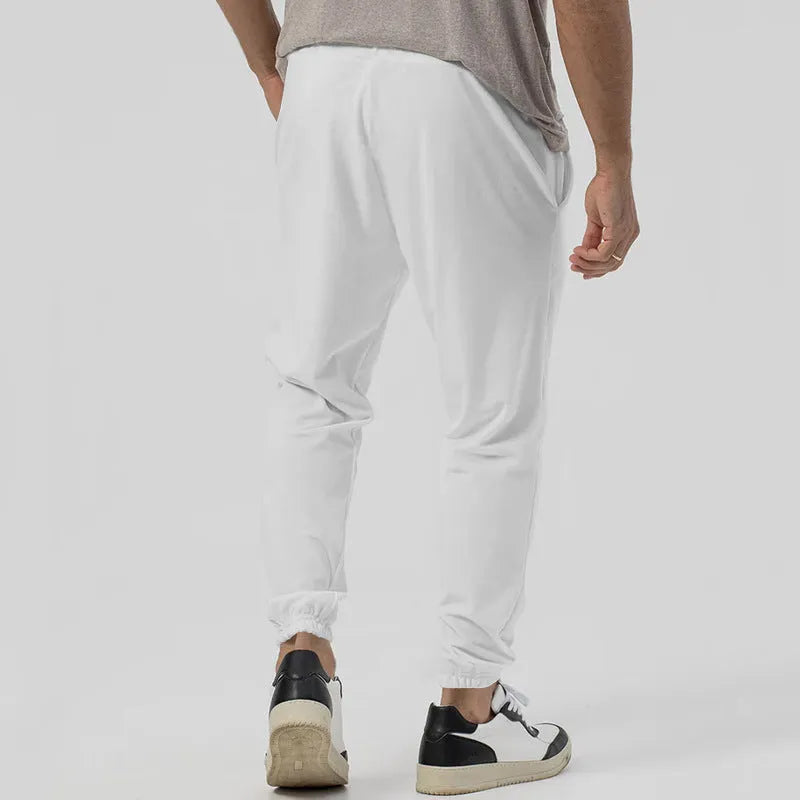Men's grey cotton blend track sweatpants with straight leg design and elastic waistband