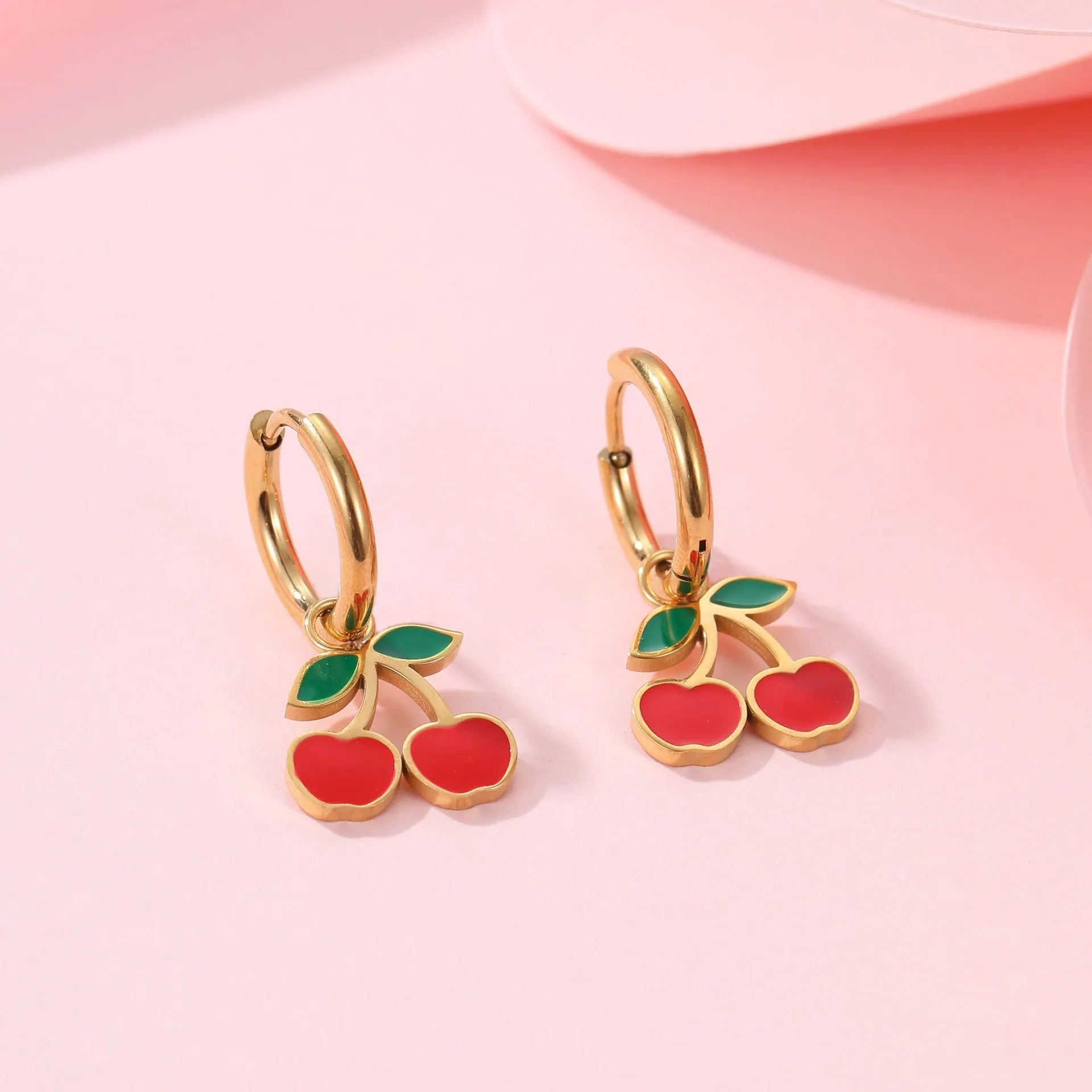 Cherry charm jewellery set showing necklace, bracelet, earrings, and ring in 18K gold plated stainless steel