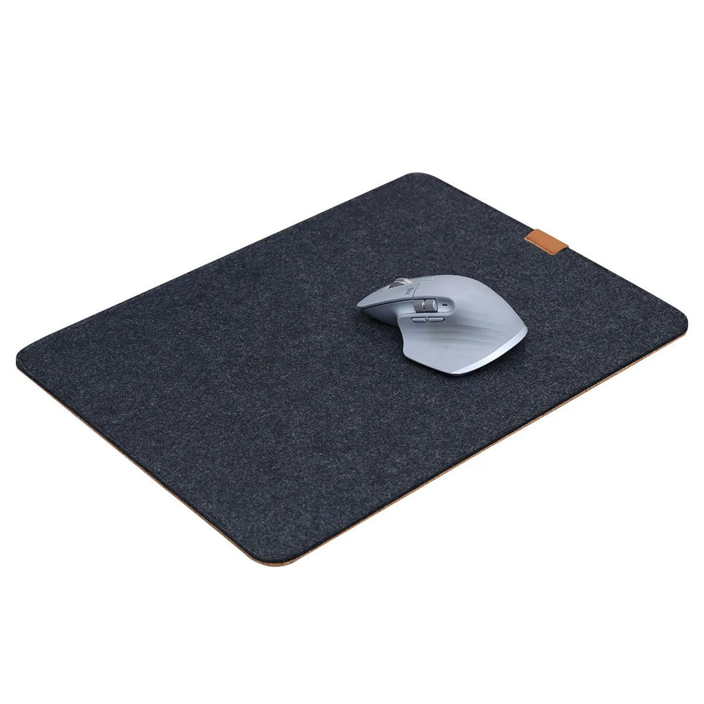 Winter warm grey and black felt desk mouse mat with cork non-slip base on a wooden table.