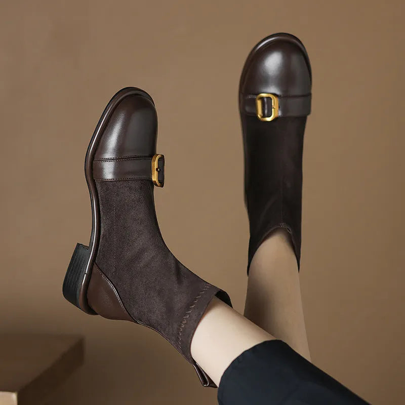 Women's black low heel Martin boots with buckle stitching and front lace-up fastening on a round toe.