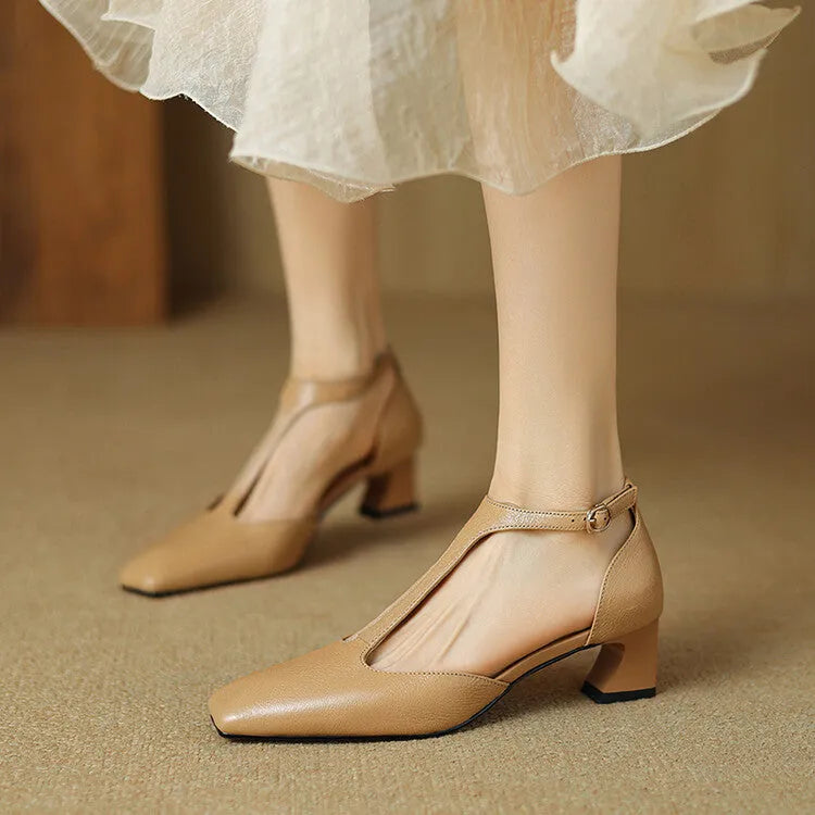 Wine red women's high heels with a square toe, chunky heel, buckle fastening, and visible stitching.