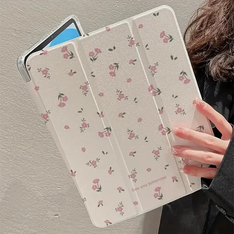 Transparent floral tri-fold iPad protective case showing magnetic stand functionality for Apple tablet models