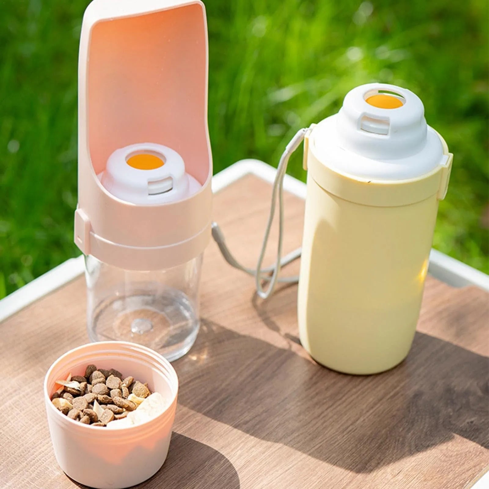 Grey 2-in-1 portable dog water bottle and feeder with lanyard for outdoor use