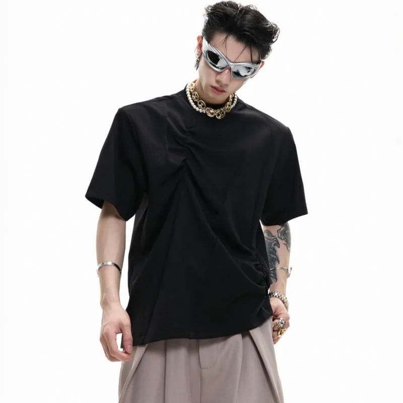 Men's loose grey cotton t-shirt with three-dimensional pleats and asymmetric stitching detail.