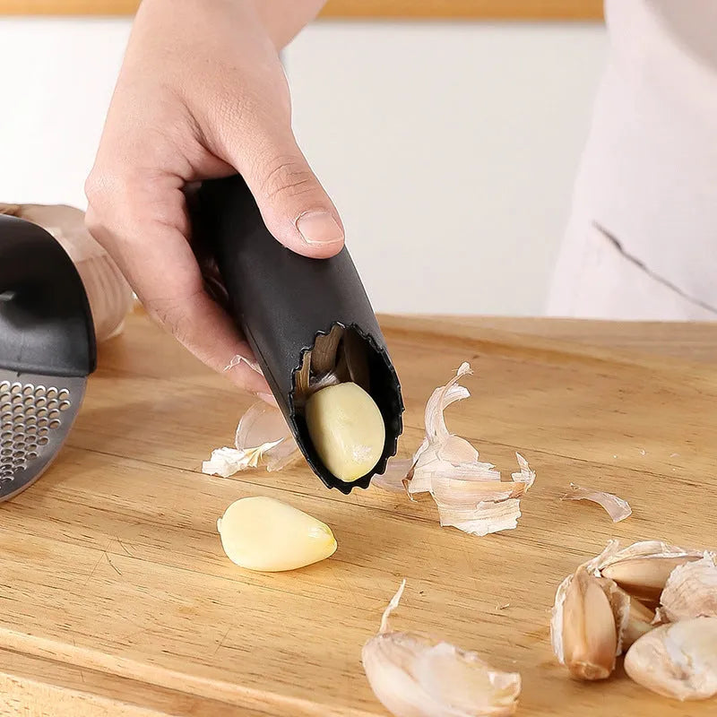 304 stainless steel garlic press with PP handle in 11cm size on kitchen counter