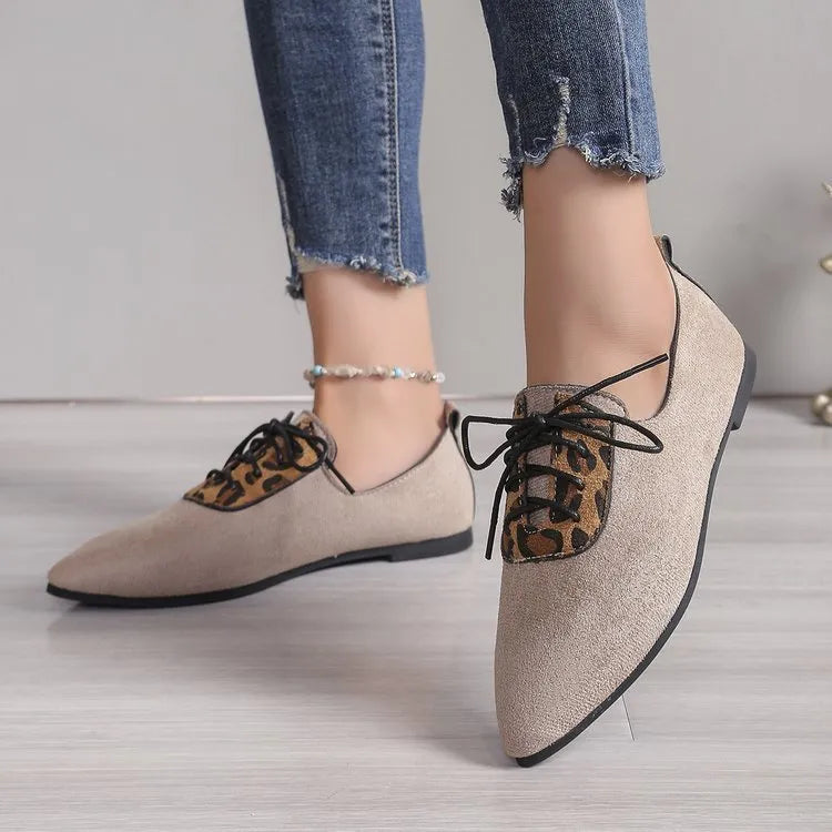Beige leopard print women's pumps with a pointed toe, shown in a plus size.