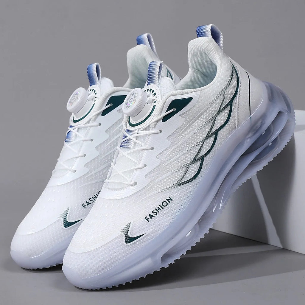 White low-top casual sports shoes with rotating button lace-up and mesh upper on a rubber sole.