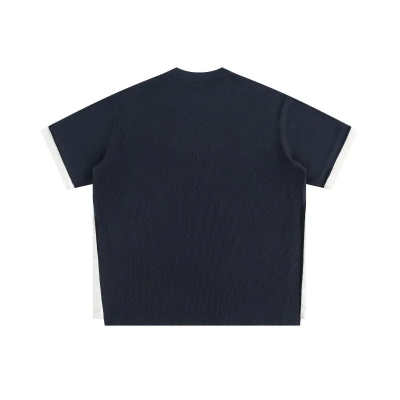 Retro alphabet embroidered waffle knit T-shirt in loose fit, shown in navy blue.