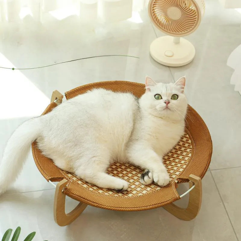 Brown woven rattan pet hammock bed measuring 46cm square with crib-style sides