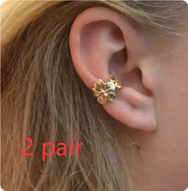 Gold starfish and conch shell earrings with electroplated finish and detailed coastal designs